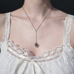 Green aventurine caged pearl drop on a antique style silver rosary necklace